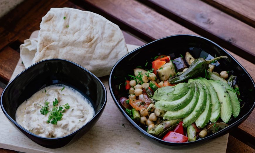 File photo showing a bowl of hummus and other food items. (Kevin McCutcheon/Unsplash)