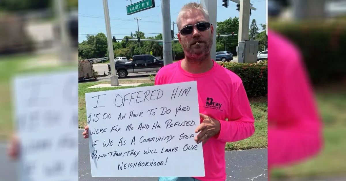 Business owner Ryan Bray warns drivers not to donate to a homeless man who refused a job offer in Brandenton, Fla., on July 14, 2019. (Courtesy of Betsy Ryan/Facebook)