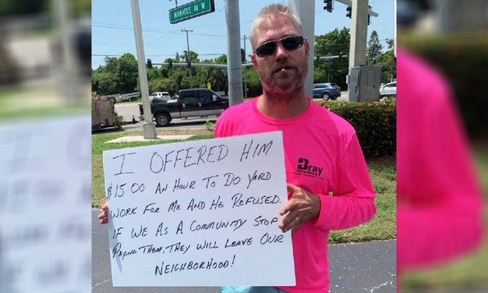 Business owner Ryan Bray warns drivers not to donate to a homeless man who refused a job offer in Brandenton, Fla., on July 14, 2019. (Courtesy of Betsy Ryan/Facebook)