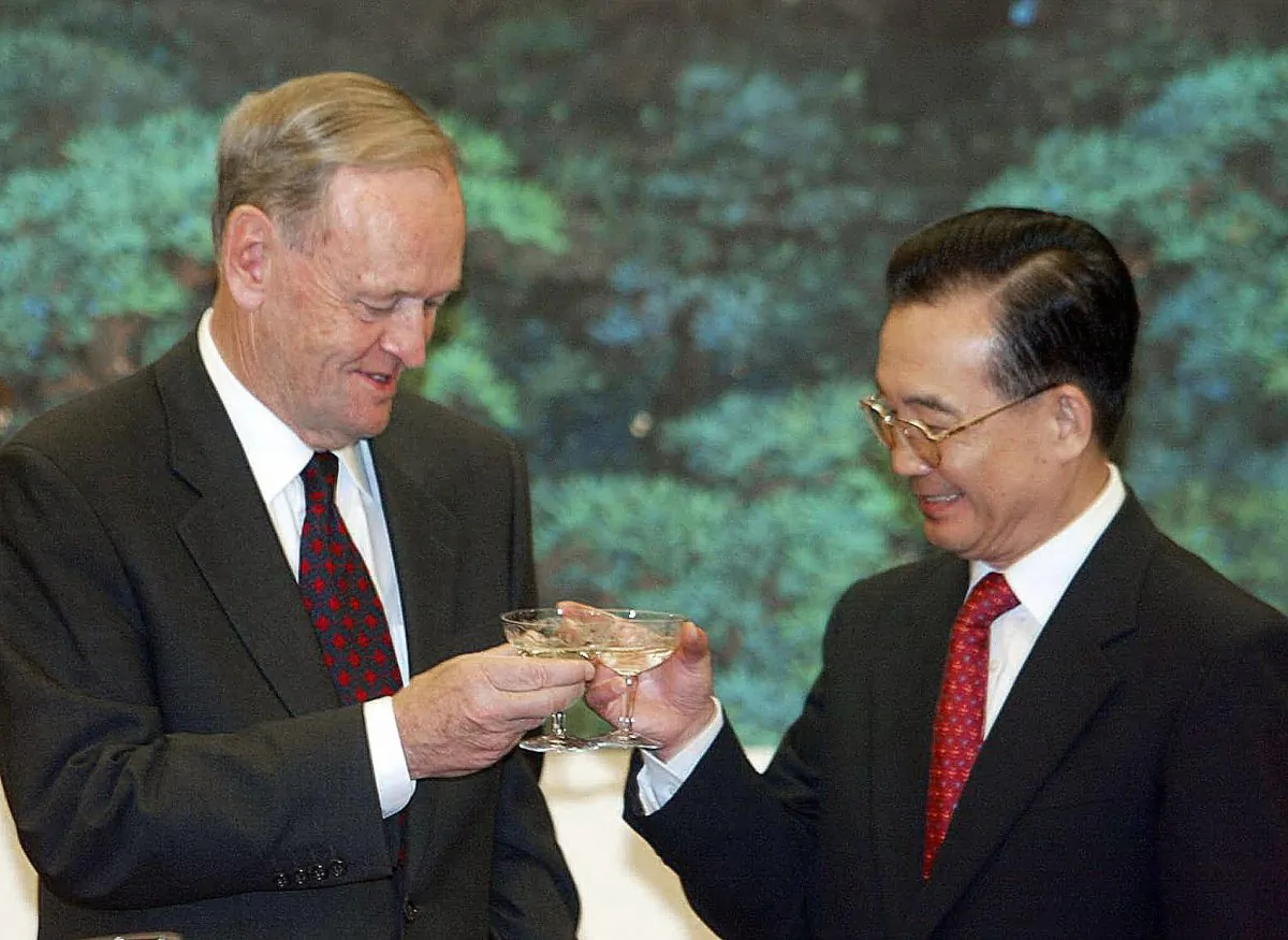 Then-Canadian Prime Minister Jean Chretien and Chinese Premier Wen Jiabao toast each other following a signing ceremony on Oct. 22, 2003. (Frederic J. Brown/AFP/Getty Images)