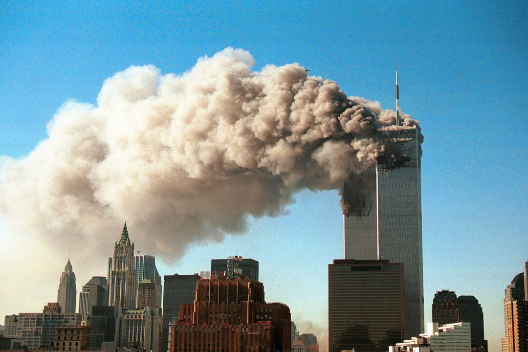 Smoke pours from the twin towers of the World Trade Center after they were hit by two hijacked airliners in a terrorist attack in New York City on Sept. 11, 2001. (Robert Giroux/Getty Images)