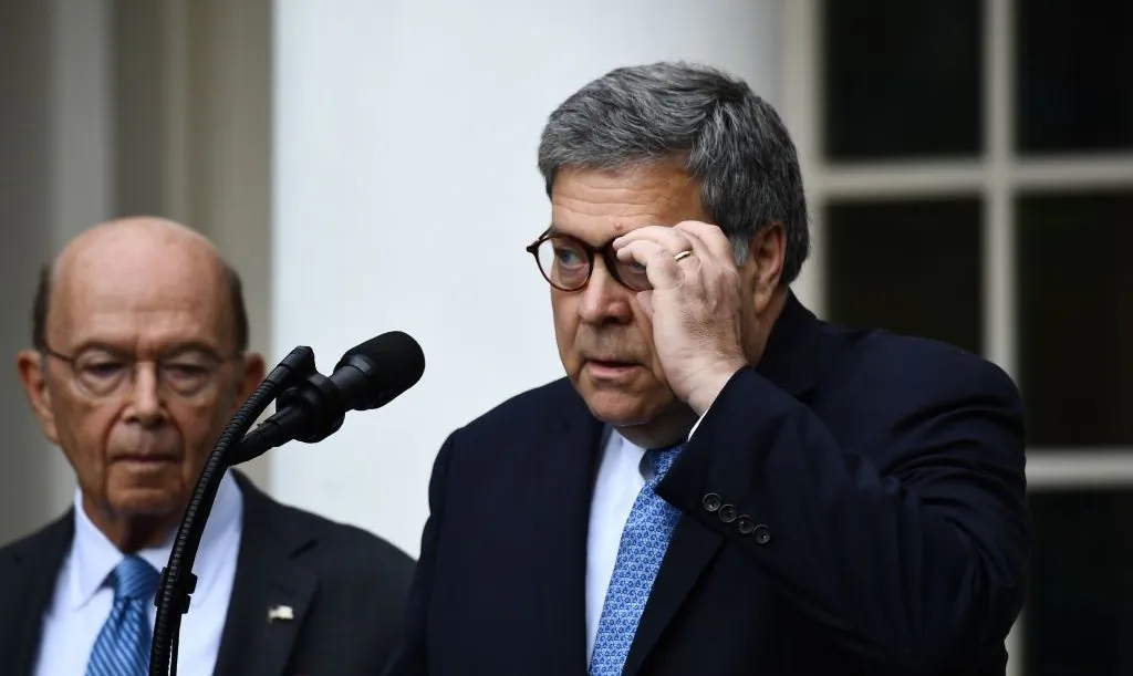 U.S. Secretary of Commerce Wilbur Ross (L) looks on as U.S. Attorney General William Barr delivers remarks on citizenship and the census in the Rose Garden at the White House in Washington, D.C., on July 11, 2019. (Brendan Smialowski/AFP/Getty Images)