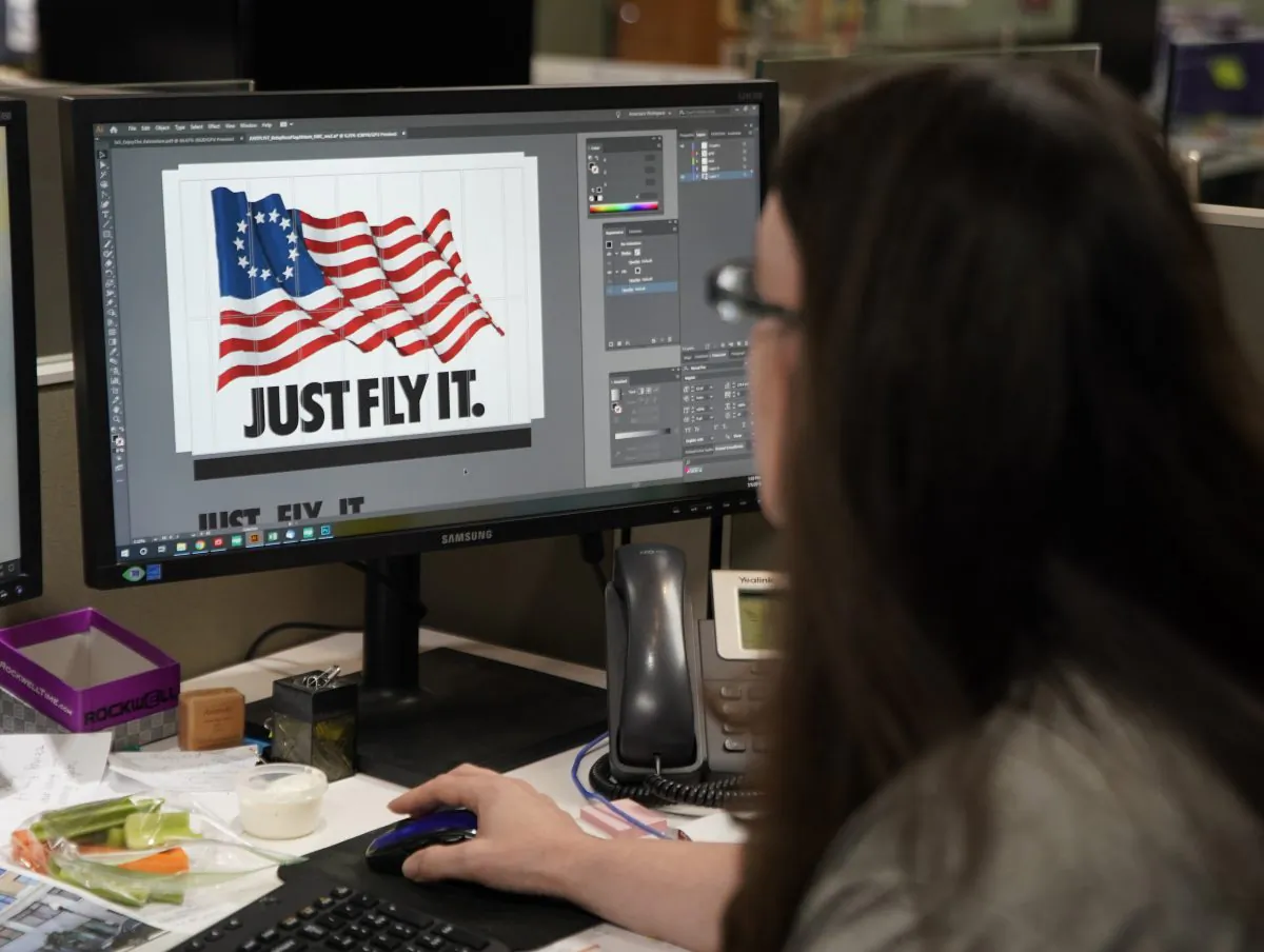 A worker designs a Just Fly It t-shirt with the Betsy Ross flag at Colonial Flag on July 5, 2019 in Salt Lake City, Utah. George Frey/Getty Images
