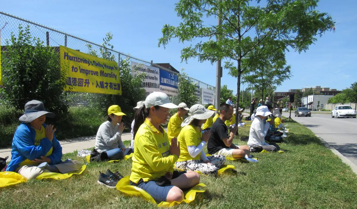 Falun Gong practitioners gather to peacefully demonstrate in front of the Chinese Embassy in Ottawa on July 20, 2019. The event marked 20 years of persecution by the Chinese Communist Party, and speakers urged the Canadian government to call on the regime to end its brutal campaign. (Donna He/The Epoch Times)
