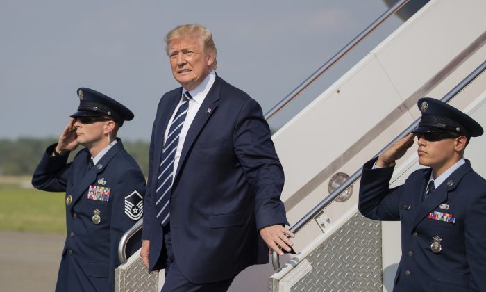 President Donald Trump, disembarks Air Force One upon arrival at Morristown Municipal Airport, in Morristown, N.J., on July 19, 2019. (AP Photo/Manuel Balce Ceneta)