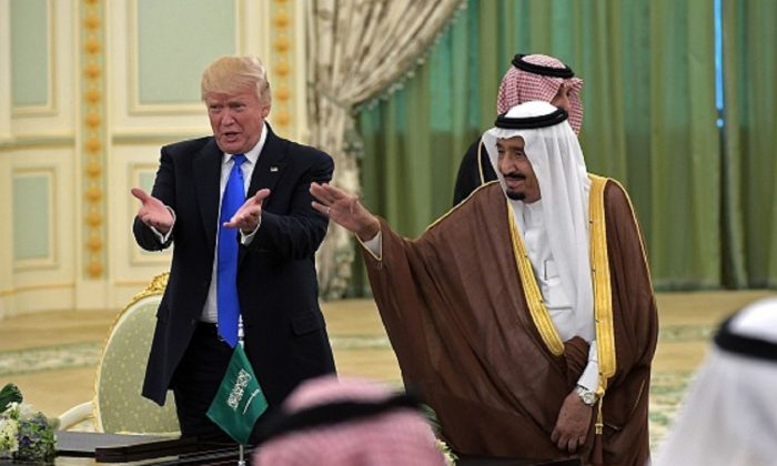 President Donald Trump (L) and Saudi Arabia's King Salman bin Abdulaziz al-Saud gesture during a signing ceremony at the Saudi Royal Court in Riyadh on May 20, 2017. (Mandelngan/AFP/Getty Images)