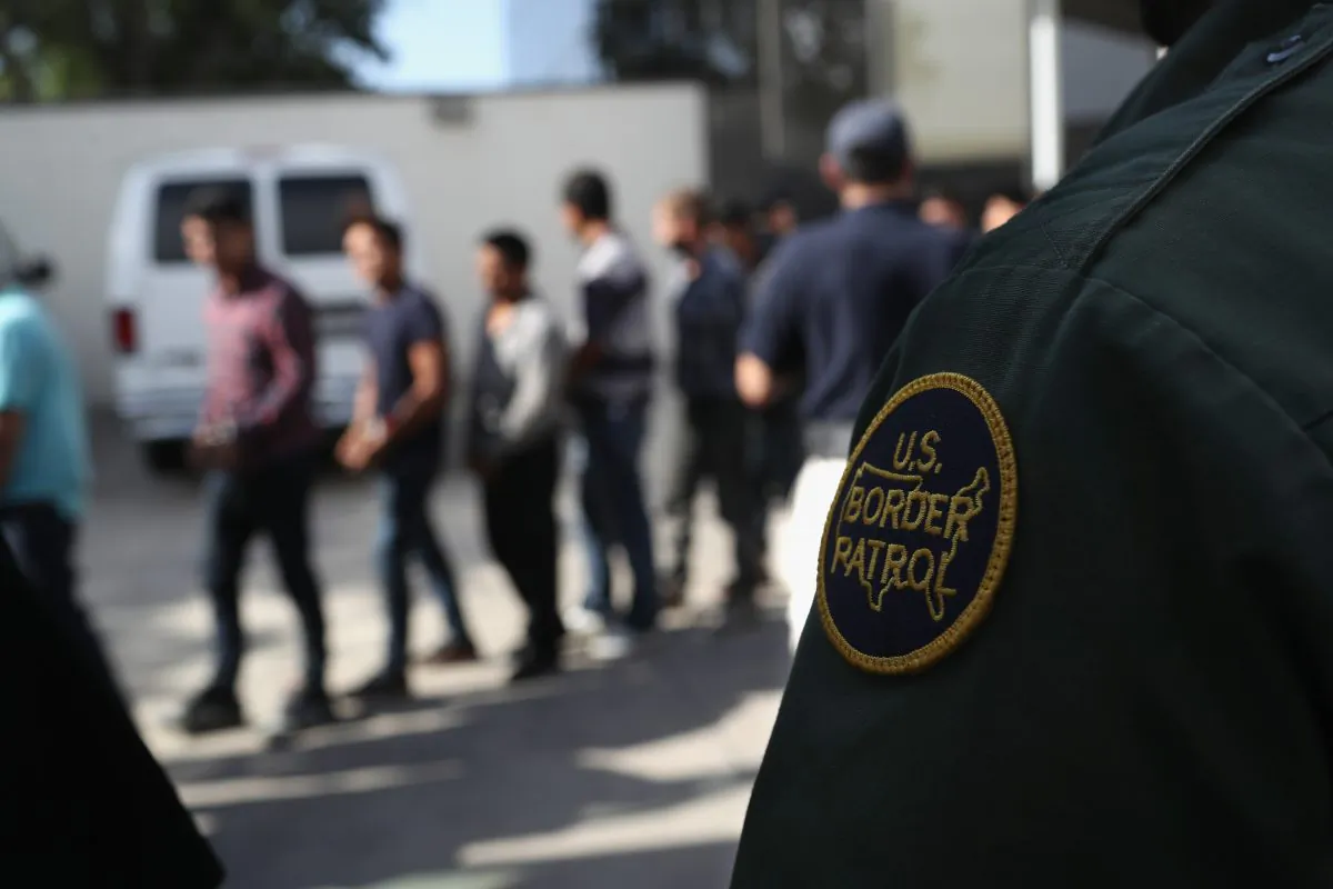 Illegal immigrants leave a U.S. federal court in shackles in McAllen, Texas on June 11, 2018. (John Moore/Getty Images)