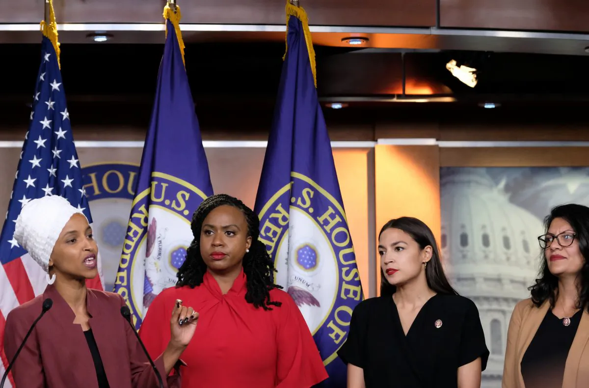Representatives Ilhan Omar (D-MN) speaks as, Ayanna Pressley (D-MA), Alexandria Ocasio-Cortez (D-NY), and Rashida Tlaib (D-MI) listen during a press conference at the U.S. Capitol in Washington on July 15, 2019. (Alex Wroblewski/Getty Images)