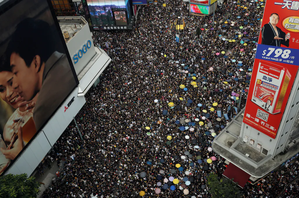 Protesters march to call for democratic reforms, in Hong Kong, on July 21, 2019. (Tyrone Siu/Reuters)