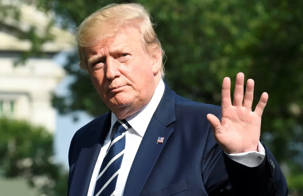 President Donald Trump waves to the press as he returns to the White House, Washington, U.S., after a weekend at his golf club in Bedminster, New Jersey, on July 21, 2019. (Reuters/Mike Theiler)