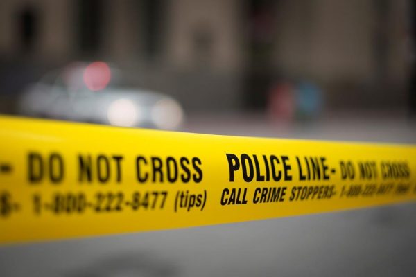Police tape is shown in Toronto, May 2, 2017. Statistics Canada says the country's crime rate ticked up again in 2018, for a fourth year in a row, though it was still lower than it was a decade ago. (Graeme Roy/The Canadian Press)
