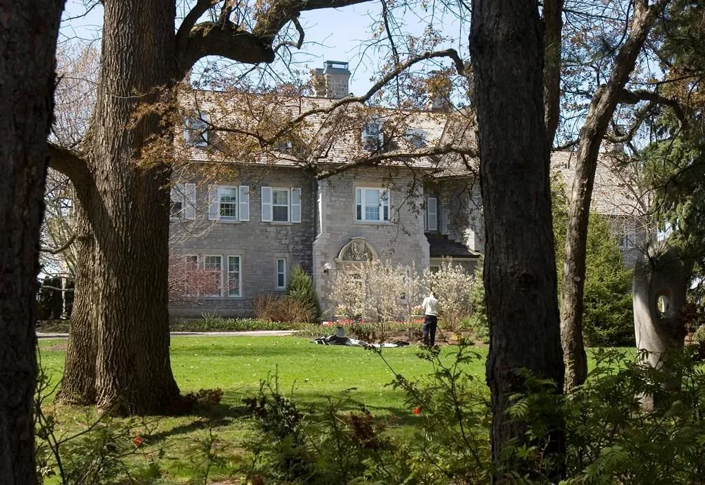 A gardener works on the grounds at the Prime Minister's residence at 24 Sussex Drive in Ottawa, May 6, 2008. Nearly four years after Justin Trudeau opted not to move into the prime minister's official residence over concerns about its crumbling state, the building remains vacant short of staff who continue to use the kitchen to prepare meals for Trudeau and his family. (Tom Hanson/The Canadian Press)