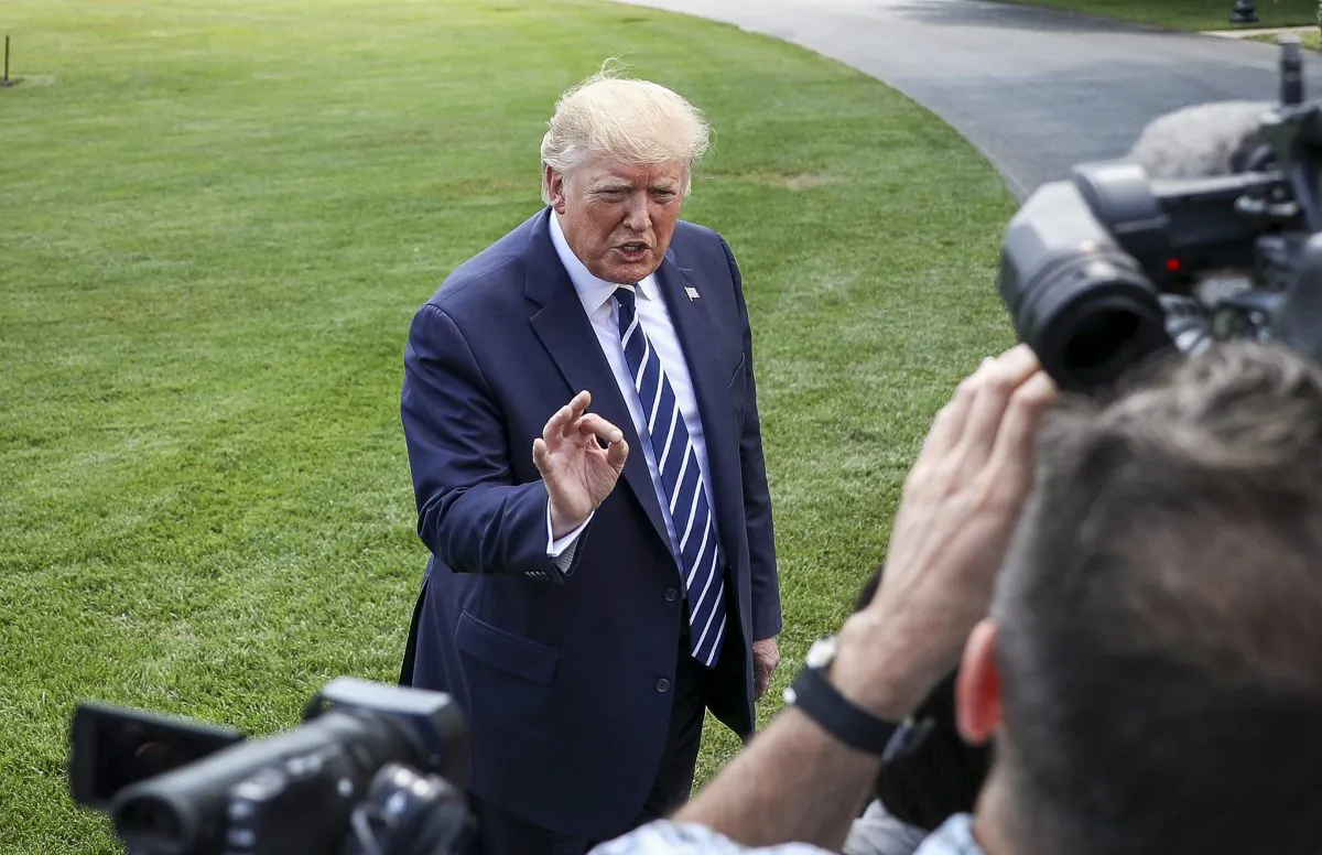 President Donald Trump speaks to media before departing the White House on Marine One en route to Bedminster, N.J., on July 19, 2019. (Charlotte Cuthbertson/The Epoch Times)
