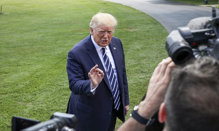 President Donald Trump speaks to media before departing the White House on Marine One en route to Bedminster, N.J., on July 19, 2019. (Charlotte Cuthbertson/The Epoch Times)