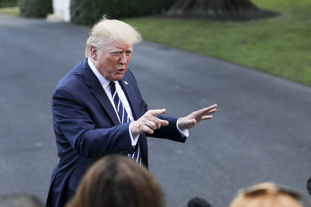 President Donald Trump speaks to media before departing the White House on Marine One en route to Bedminster, N.J., on July 19, 2019. (Charlotte Cuthbertson/The Epoch Times)