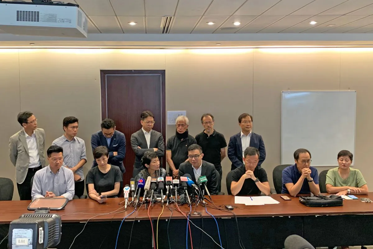 A press conference held by pan-democratic councilors condemning police giving allowances for the suspected mafia to assault local residents. (Poon Zaishu/The Epoch Times)