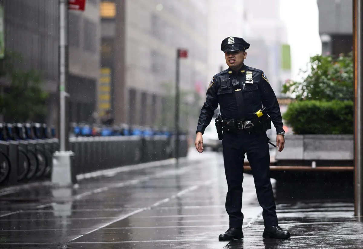 A policeman looks down a street in Midtown Manhattan in New York, on June 10, 2019. (Johannes Eisele/AFP/Getty Images)
