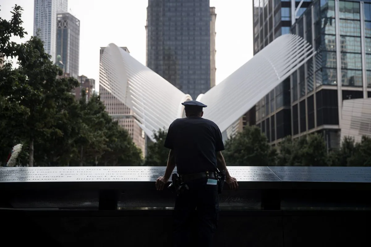 In this file image, an NYPD officer pauses at the National September 11 Memorial, September 11, 2017 in New York City. (Drew Angerer/Getty Images)