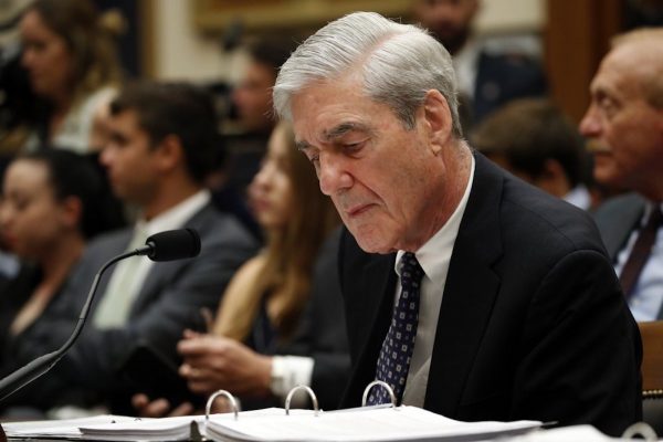 Mueller looks at notes