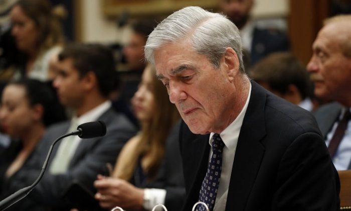 Former special counsel Robert Mueller looks at notes as he testifies before the House Judiciary Committee hearing on his report on Russian election interference, on Capitol Hill in Washington on July 24, 2019. (Alex Brandon/AP Photo)