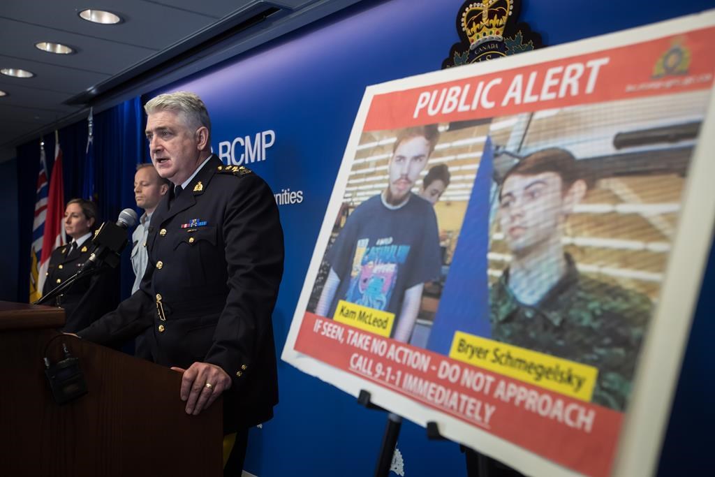 Security camera images recorded in Saskatchewan of Kam McLeod, 19, and Bryer Schmegelsky, 18, are displayed as RCMP Assistant Commissioner Kevin Hackett speaks during a news conference in Surrey, B.C., on July 23, 2019. (Darryl Dyck/The Canadian Press)
