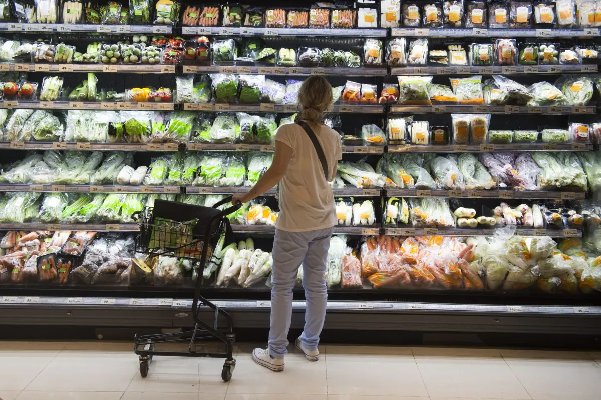 A person shops for groceries in a file photo. (Romeo Gacad/AFP/Getty Images)