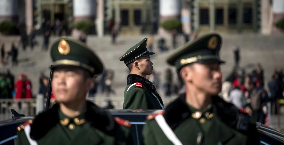 Paramilitary police officers stand in front of the Great Hall of the People during the opening of China's rubber-stamp legislature, the National People's Congress, in Beijing on March 5, 2017.
(Fred Dufour/AFP/Getty Images)