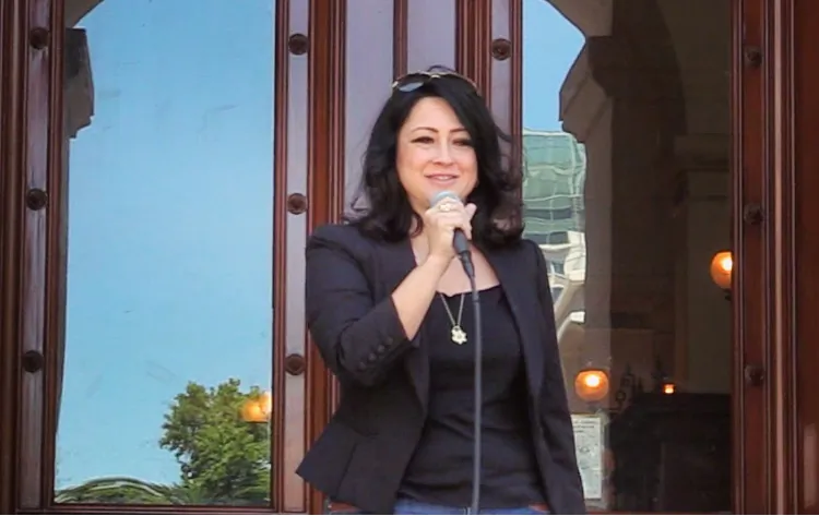 Erin Cruz speaking at a rally in front of California state capitol building on June 21, 2019. (Nathan Su/Epoch Times)