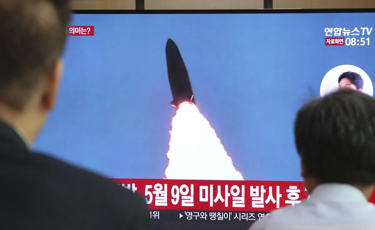People watch a TV showing a file image of North Korea's missile launch during a news program at the Seoul Railway Station in Seoul, South Korea on July 25, 2019. (Ahn Young-joon/AP)