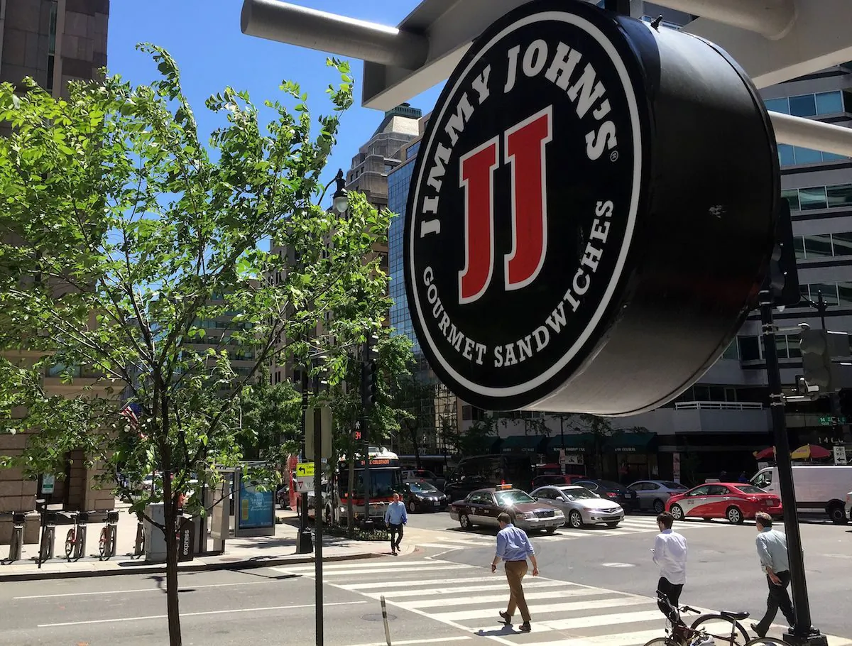 A logo of the sandwich restaurant chain, specializing in delivery Jimmy John's hangs outside one of their shops in downtown Washington, DC, on June 9, 2016. (Mladen Antonov /AFP/Getty Images)