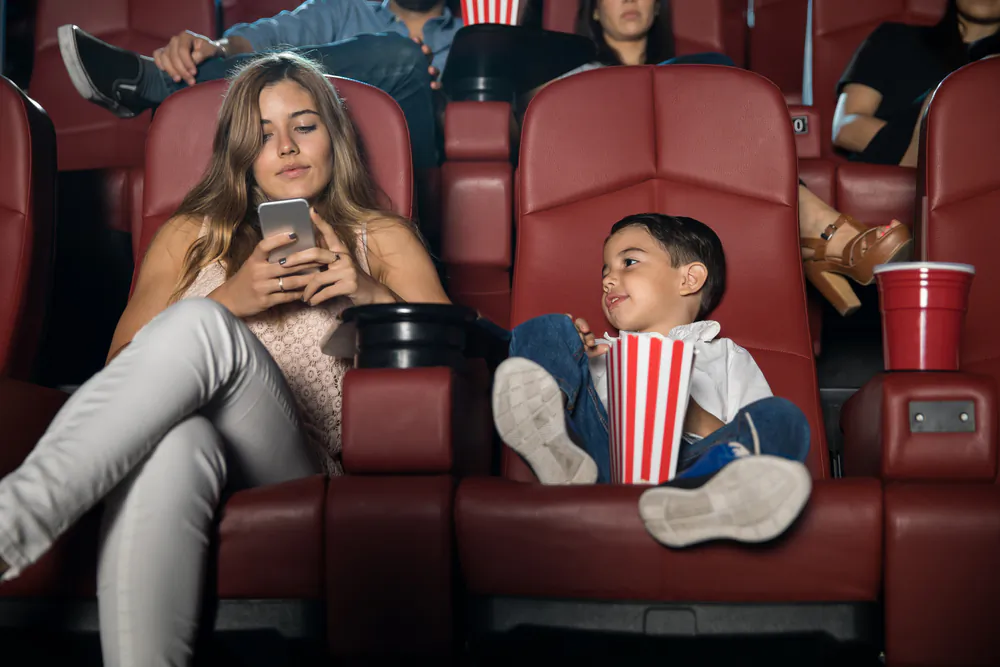 Perhaps you’ve noticed yourself increasingly annoyed when your children 'interrupt' what you’re looking at on your phone. (ANTONIODIAZ/SHUTTERSTOCK)