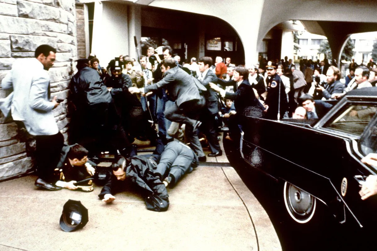 Police and Secret Service agents reacting during the assassination attempt on then US president Ronald Reagan, after a conference outside the Hilton Hotel in Washington, D.C. on March 30, 1981. (just behind the car). Reagan was hit in the chest and was hospitalized for 12 days. Hinckley was aquitted 21 June 1982 after a jury found him mentally unstable. (Mike Evens/AFP/Getty Images)