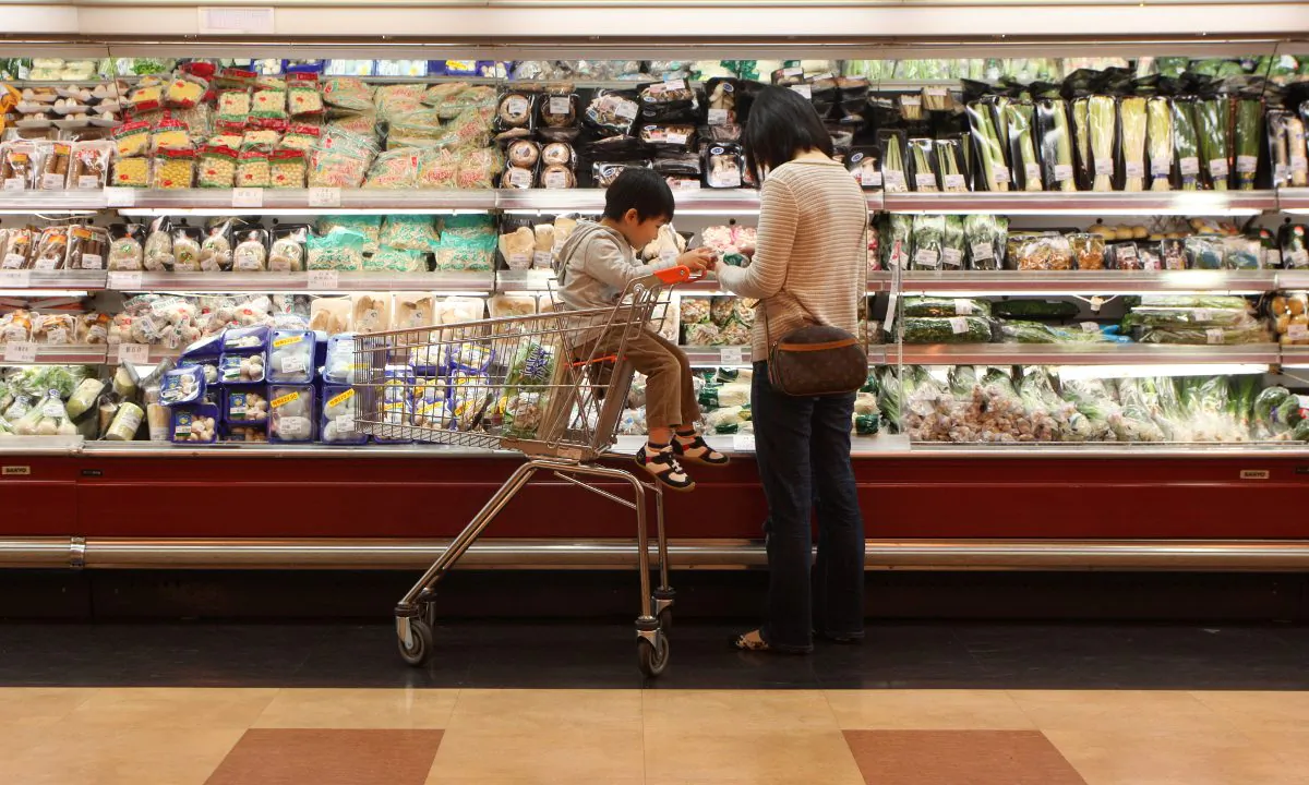 A woman and boy in a supermarket in China. (Ed Jones/AFP/Getty Images)