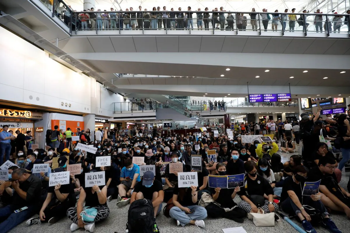 Protesters and members of the aviation industry stage a protest against the recent violence in Yuen Long, at Hong Kong airport, on July 26, 2019. (Edgar Su/Reuters)
