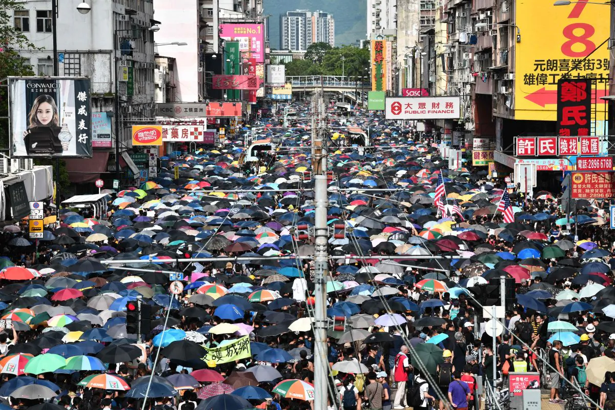 Protesters demonstrate in the district of Yuen Long in Hong Kong on July 27, 2019. Crowds of Hong Kong protesters defied a police ban and began gathering in a town close to the Chinese border to rally against suspected triad gangs who beat up pro-democracy demonstrators there. (Anthony Wallace/AFP/Getty Images)