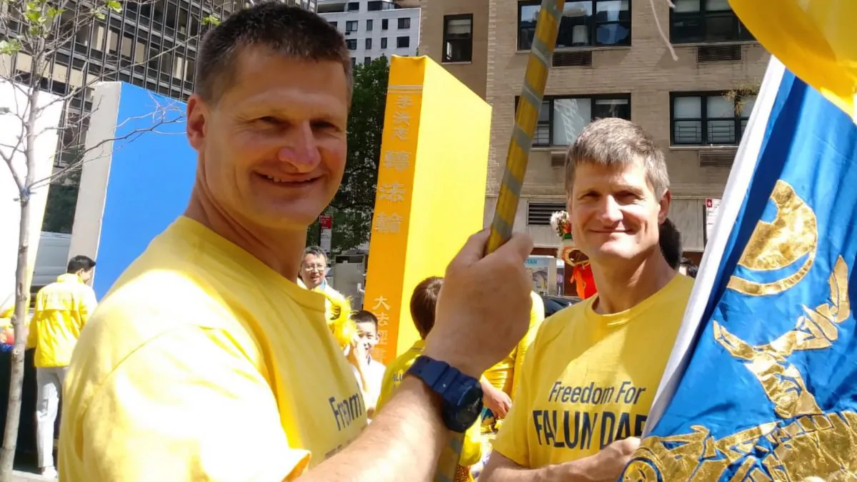 Nick and Simon Vereshaka at a Falun Dafa parade in New York in May 2018. (Courtesy of Nick Vereshaka)
