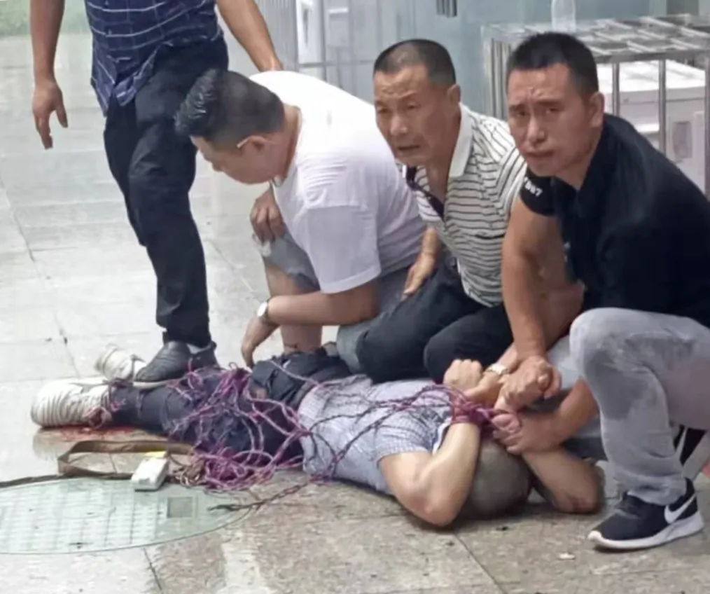 Xu Weigang was controlled by village officials after he made the blasts on July 26, 2019. (Provided to The Epoch Times by interviewee)