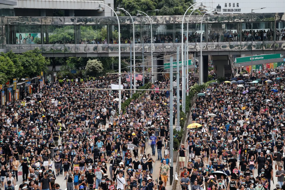 Pro-democracy protesters march to protest against police violence during previous marches, in central Hong Kong, on July 28, 2019. (Tyrone Siu/Reuters)