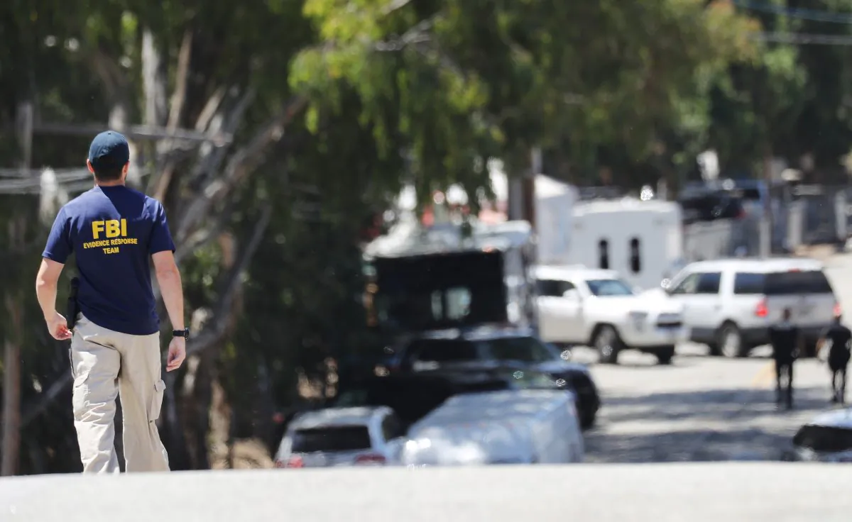 An FBI agent walks toward the site of the Gilroy Garlic Festival in Gilroy, Calif., on July 29, 2019.(Mario Tama/Getty Images)