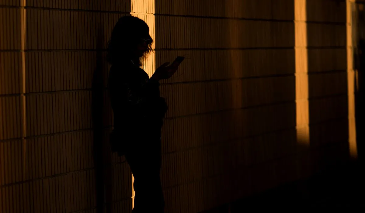 A woman using a phone in China. (Dale De La Rey/AFP/Getty Images)