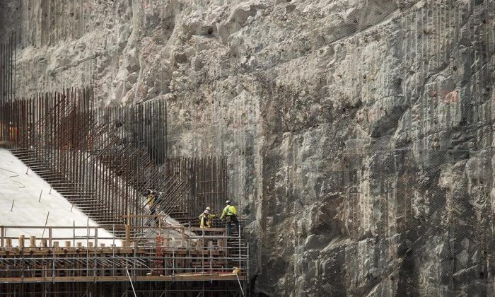 The construction site of the hydroelectric facility at Muskrat Falls, Newfoundland and Labrador is seen on Tuesday, July 14, 2015. The $12.7-billion Muskrat Falls hydroelectric dam in Labrador is finally nearing completion, billions of dollars over budget and years behind schedule. (Andrew Vaughan/The Canadian Press)