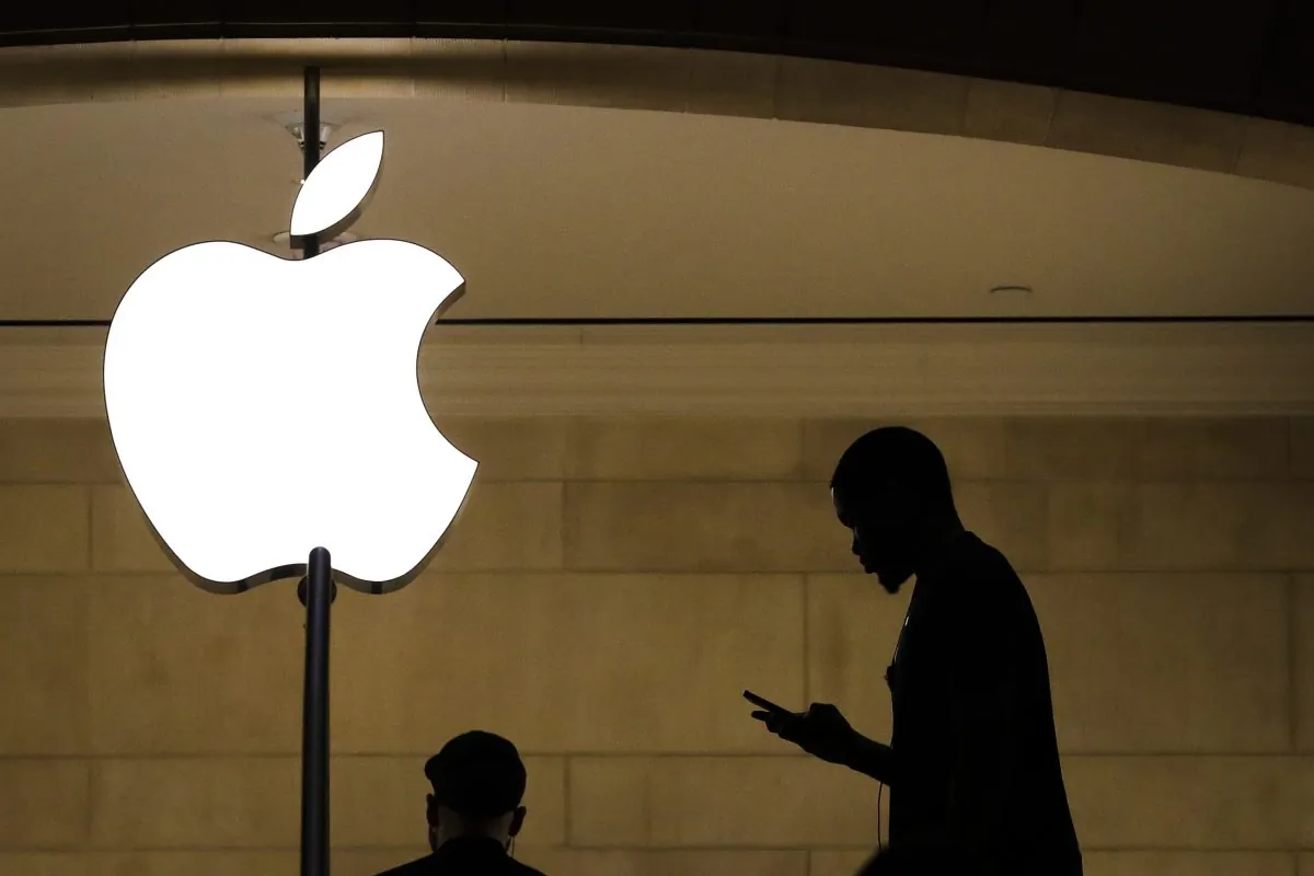 A man checks his phone in an Apple retail store in Grand Central Terminal in New York on Jan. 29, 2019. (Drew Angerer/Getty Images)