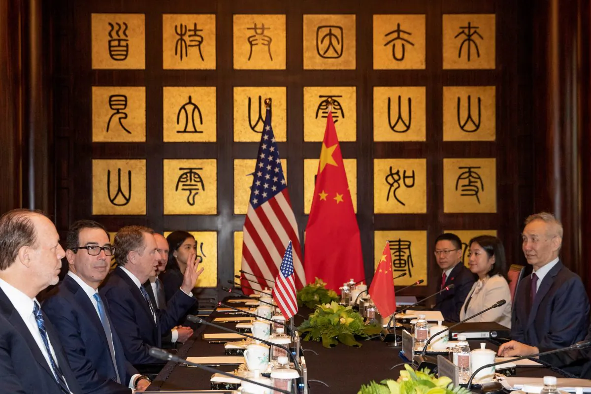 Chinese Vice Premier Liu He (at right) looks over as U.S. Trade Representative Robert Lighthizer (third from left) gestures near Treasury Secretary Steve Mnuchin (second from left) before the start of talks at the Xijiao Conference Center in Shanghai, China on July 31, 2019. (Ng Han Guan/Pool via Reuters)