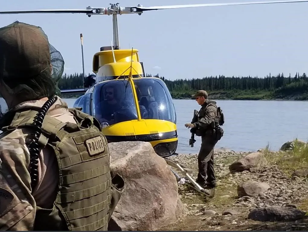 RCMP search an area near Gillam, MB. in this photo posted to their Twitter page on July 30, 2019. couple. (Twitter, Manitoba RCMP/ The Canadian Press)