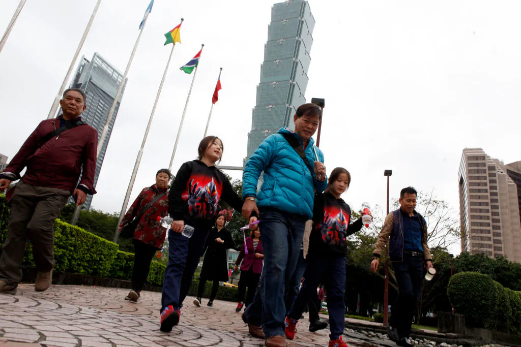 Mainland Chinese tourists visit the area outside the Taipei 101 building (back C) in Taipei on Dec. 27, 2018. (Hsu Tsun-hsu/AFP/Getty Images)