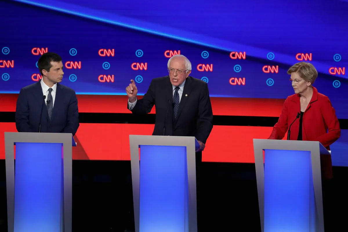 Democratic presidential candidates Sen. Bernie Sanders (D-Vt.) (C) speaks while Sen. Elizabeth Warren (D-Mass.) and South Bend, Indiana Mayor Pete Buttigieg (L) listen at the beginning of the Democratic Presidential Debate in Detroit, Michigan at the Fox Theatre on July 30, 2019. (Justin Sullivan/Getty Images)
