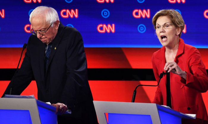 Democratic presidential hopeful US Senator from Massachusetts Elizabeth Warren (R) delivers her closing statement next to US senator from Vermont Bernie Sanders during the first round of the second Democratic primary debate of the 2020 presidential campaign season hosted by CNN at the Fox Theatre in Detroit, Mich., on July 30, 2019. (Brendan Smialowski/AFP/Getty Images)
