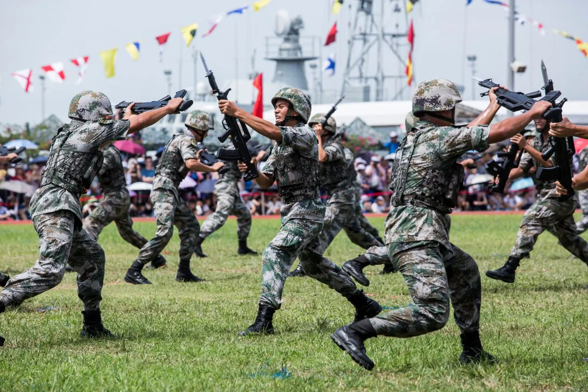 Soldiers of the Peoples' Liberation Army (PLA) perform drills during a demonstration at an open day at the Ngong Shuen Chau Barracks in Hong Kong on June 30, 2019. (ISAAC LAWRENCE/AFP/Getty Images)
