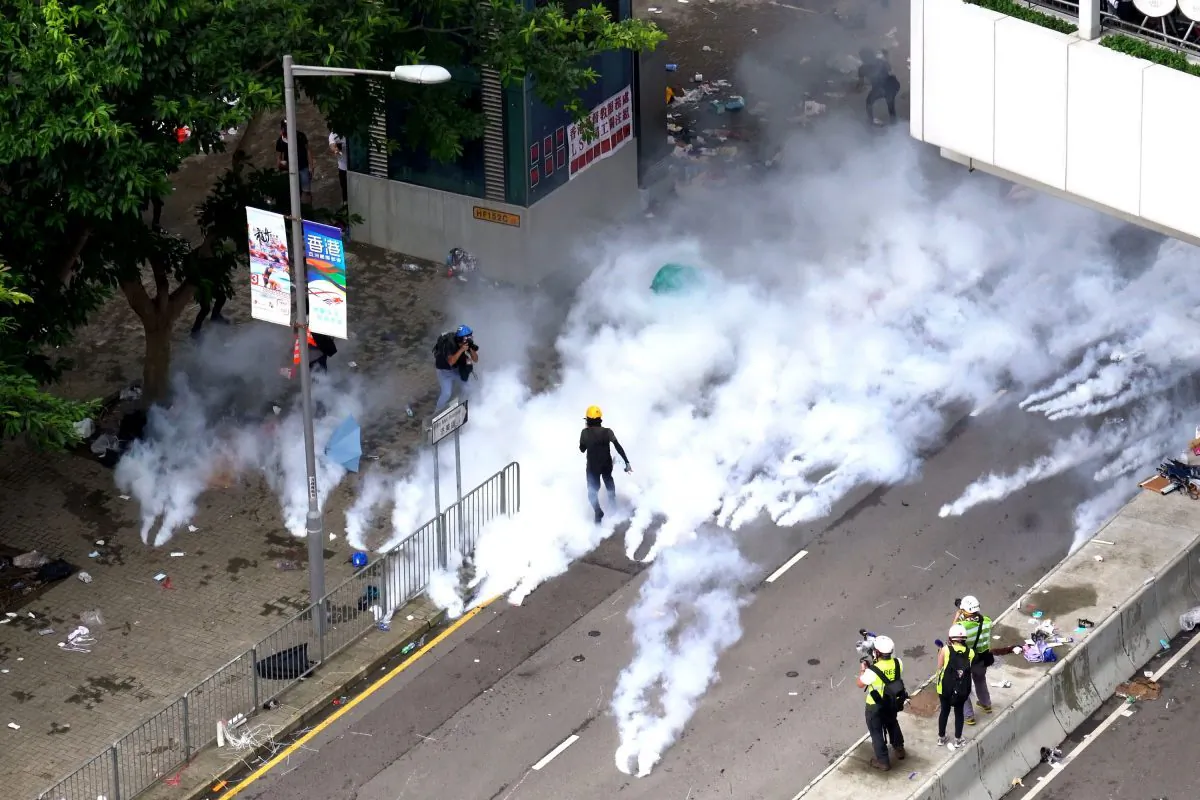 Police fire off tear gas on Tim Mei Avenue in Hong Kong on June 12, 2019. (Li Yi/The Epoch Times)