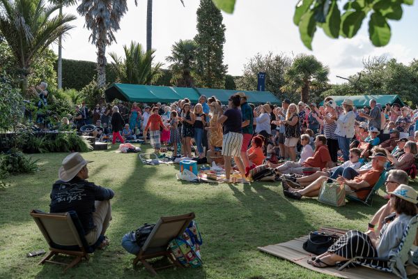 People listening and dancing to music outside